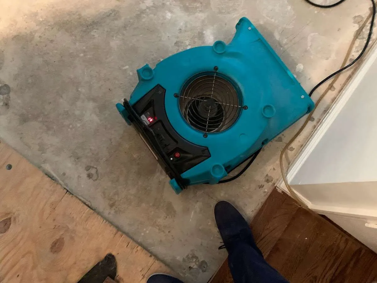 Air mover drying subfloor during Leak Detection & Repair in West Lafayette